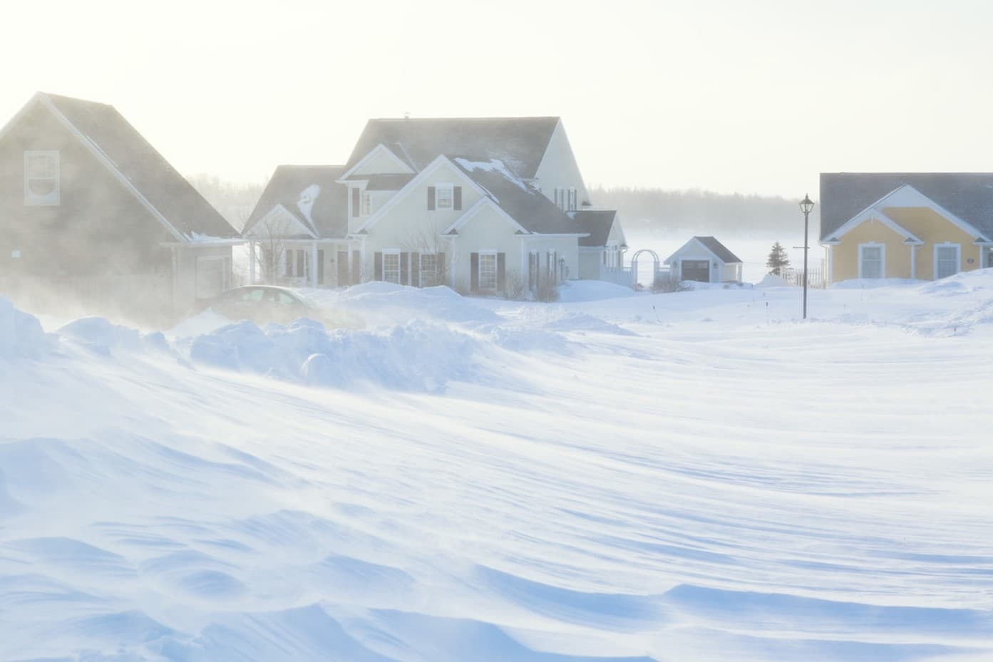 best-siding-for-cold-image-2 houses in a snowstorm